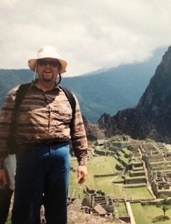 Photo of Man Leaning On Wall